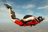 Learn to skydive student touches their hackey used to deploy their pilot chute in freefall