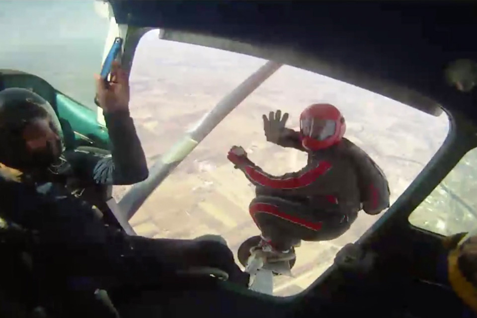 Skydiver exits the plane