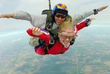 Tandem skydiving pair in freefall