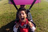 Woman screaming with joy after her first skydive at Wisconsin Skydiving Center near Milwaukee, WI
