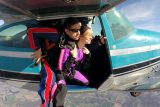 Tandem skydiving pair prepare to exit the cessna airplane