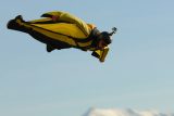 skydiver in a yellow wingsuit