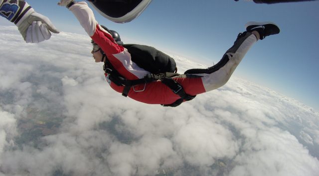 A young girl learning to skydive