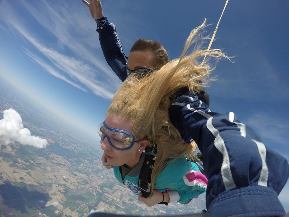 Girl's hair blowing back while skydiving at Wisconsin Skydiving Center near Chicago