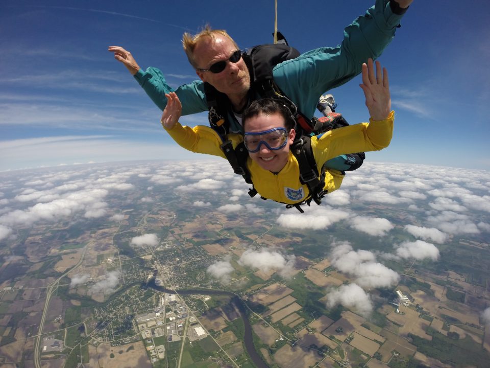 Tandem skydiver in the banana pose with arched back at Wisconsin Skydiving Center near Milwaukee