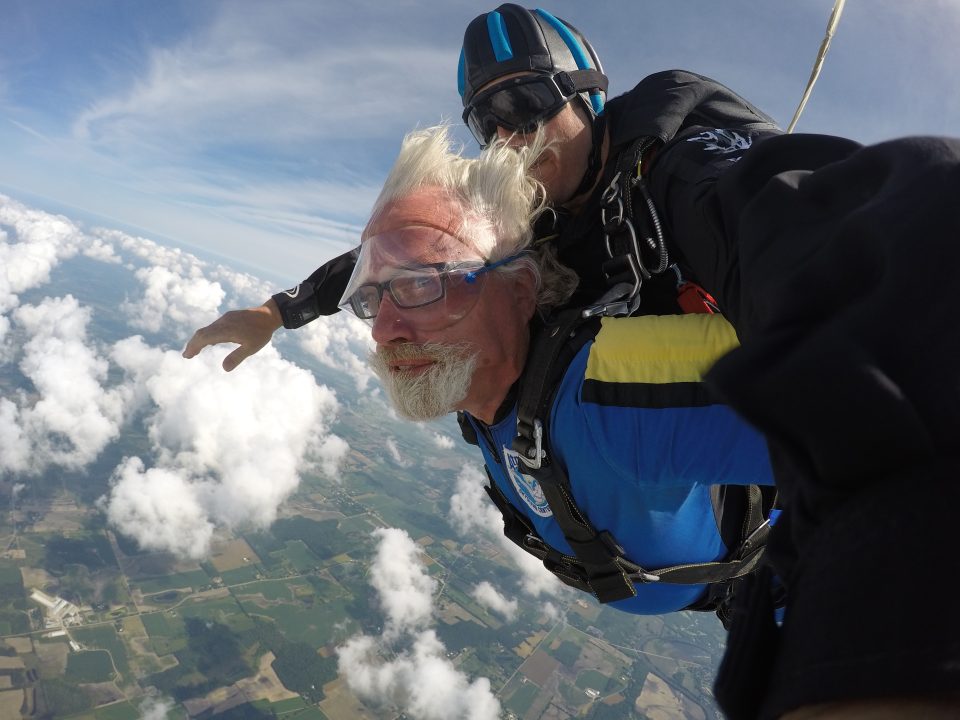 Man in his 60s with a heart condition tandem skydiving at Wisconsin Skydiving Center near Milwaukee