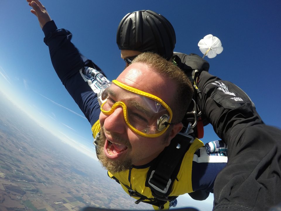 Man amazed while tandem skydiving at Wisconsin Skydiving Center near Chicago