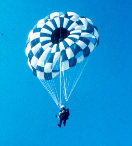 Mark descending under a round parachute