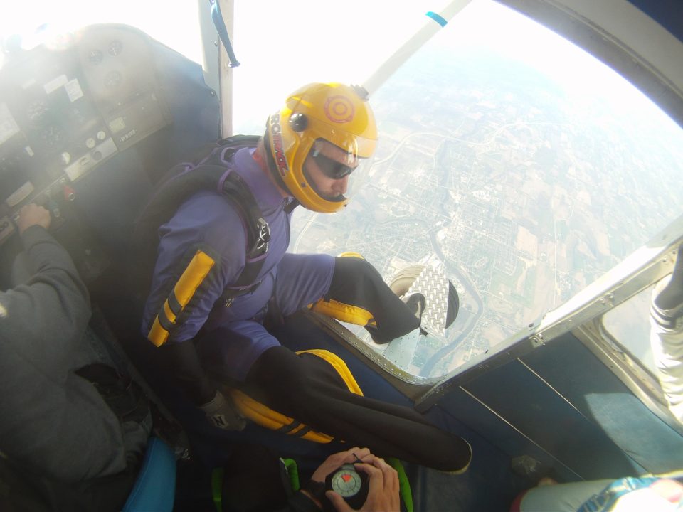 Tandem instructor Shawn Myers preparing to exit an airplane at Wisconsin Skydiving Center