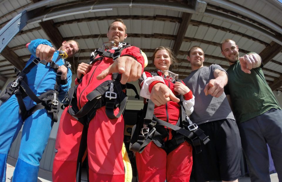 Group of people during the perfect outdoor team building activity - skydiving