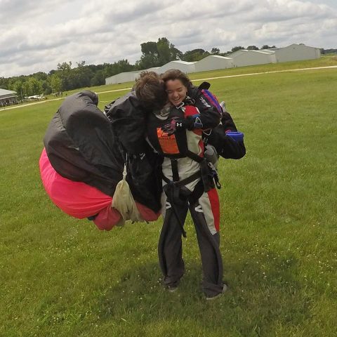 Skydiver Sarah Dillman gets a hug from Zach.