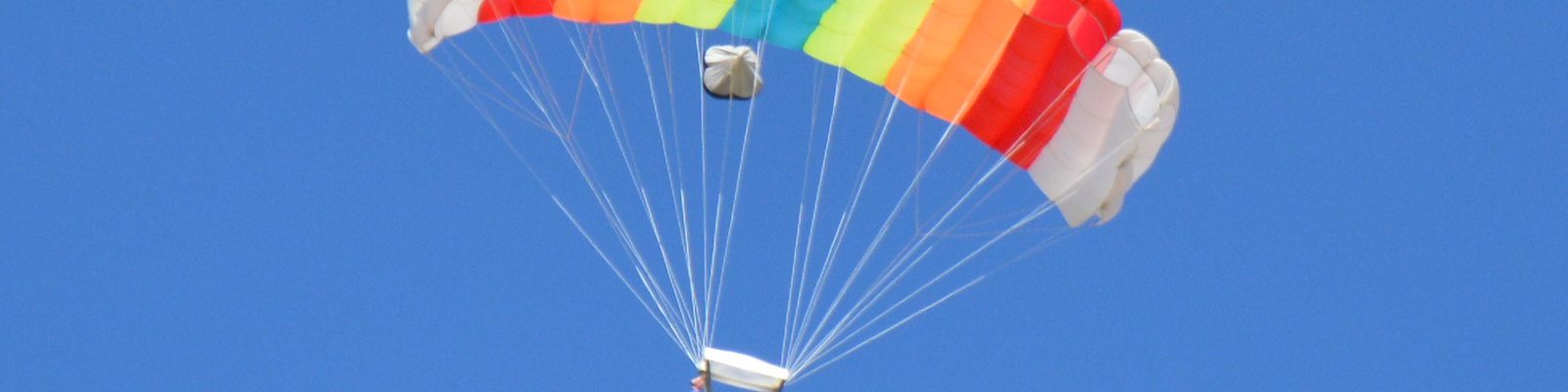 Skydiver shows how a parachute works.