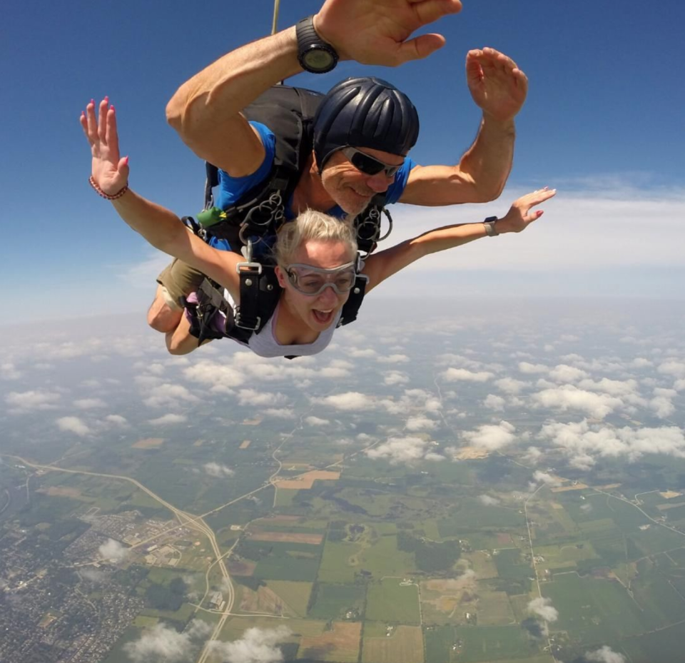 Woman in freefall in a tandem skydive at Wisconsin Skydiving Center near Milwaukee Wisconsin