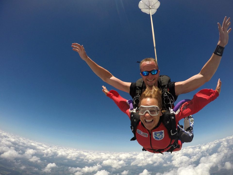 Woman smiles while making a safe tandem skydive at Wisconsin Skydiving Center near Chicago