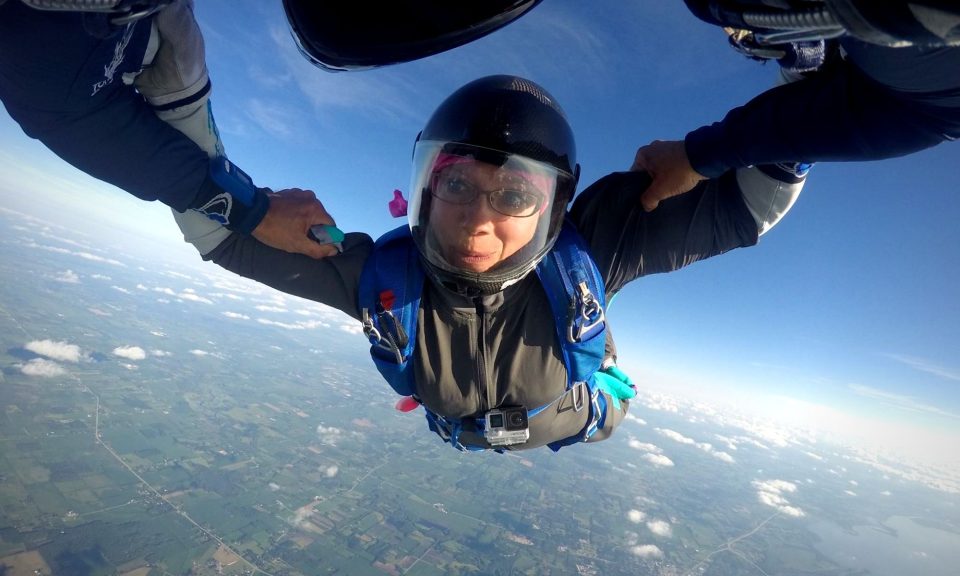 A licensed skydiver smiles during a solo freefall skydive at Wisconsin Skydiving Center near Chicago