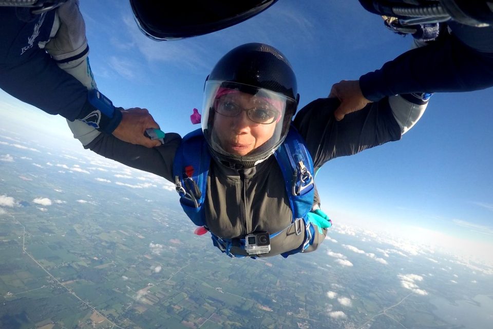A skydiver wears glasses while skydiving at Wisconsin Skydiving Center near Chicago