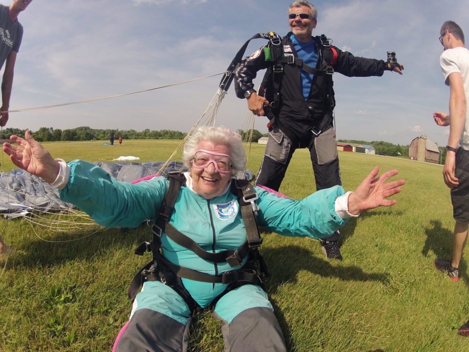 Anna Mae smiles widely after landing from her tandem skydive at Wisconsin Skydiving Center near Milwaukee