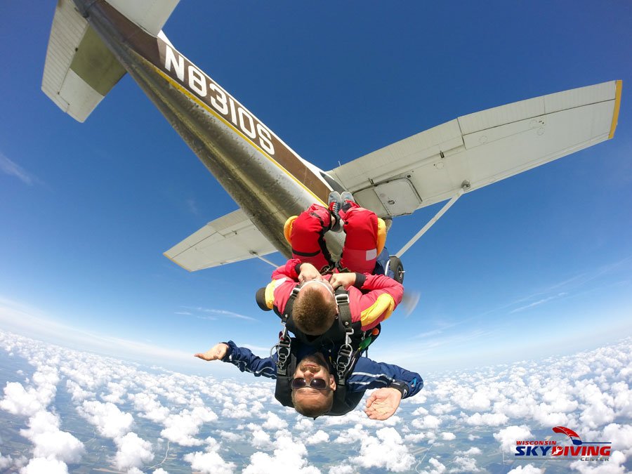 Jumping out of a plane upside down and doing flips above the clouds at Wisconsin Skydiving Center near Milwaukee