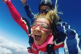 Girl screaming with joy for her first time skydive at Wisconsin Skydiving Center near Chicago