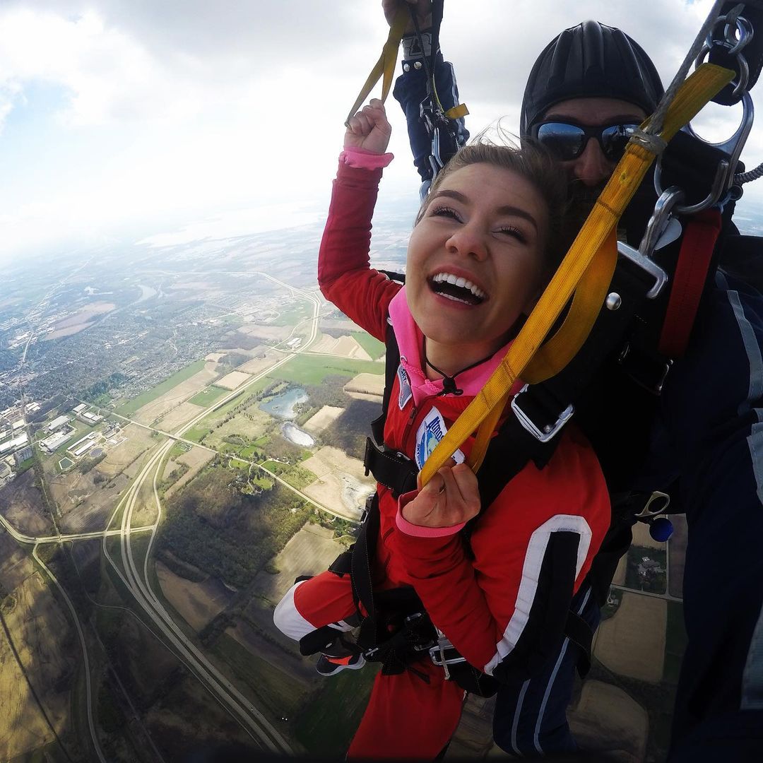 Woman smiling while finishing her first skydive at Wisconsin Skydiving Center near Milwaukee