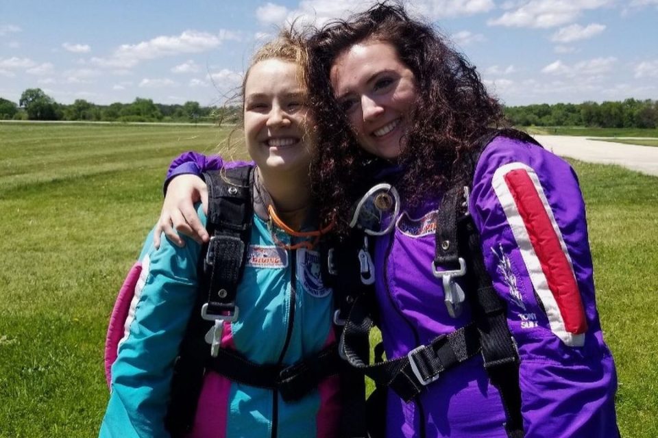 clarepfeil and a friend smiling after finishing a skydive at Wisconsin Skydiving Center near Milwaukee