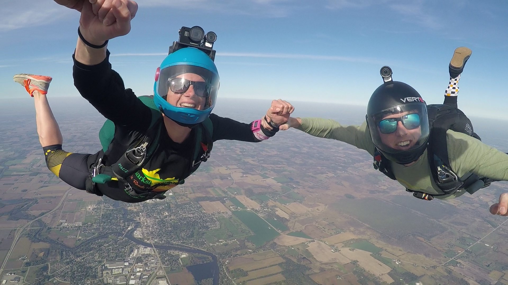 Woman solo skydiving with friends after training at Wisconsin Skydiving Center near Madison, WI