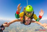 Woman skydiving in tank top and instructor wearing glasses at Wisconsin Skydiving Center near Chicago