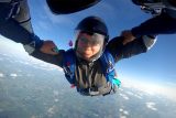 A skydiver wears glasses while skydiving at Wisconsin Skydiving Center near Chicago