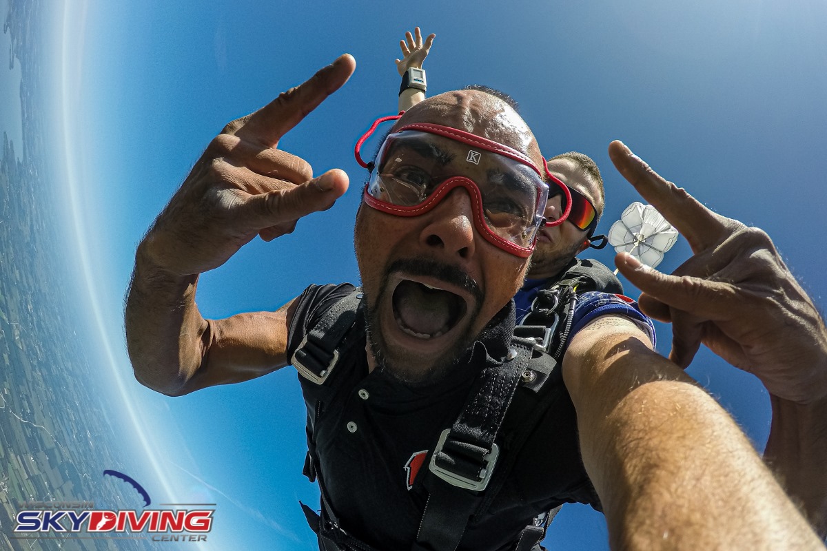 Man rockin out and looking good during skydiving freefall at Wisconsin Skydiving Center near Chicago
