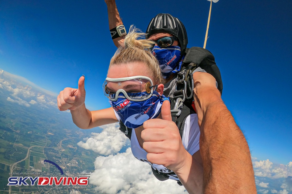 Woman with a ponytail in her hair while skydiving at Wisconsin Skydiving Center near Milwaukee