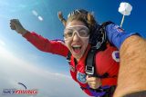 Young woman looking good and being superwoman during freefall at Wisconsin Skydiving Center near Chicago