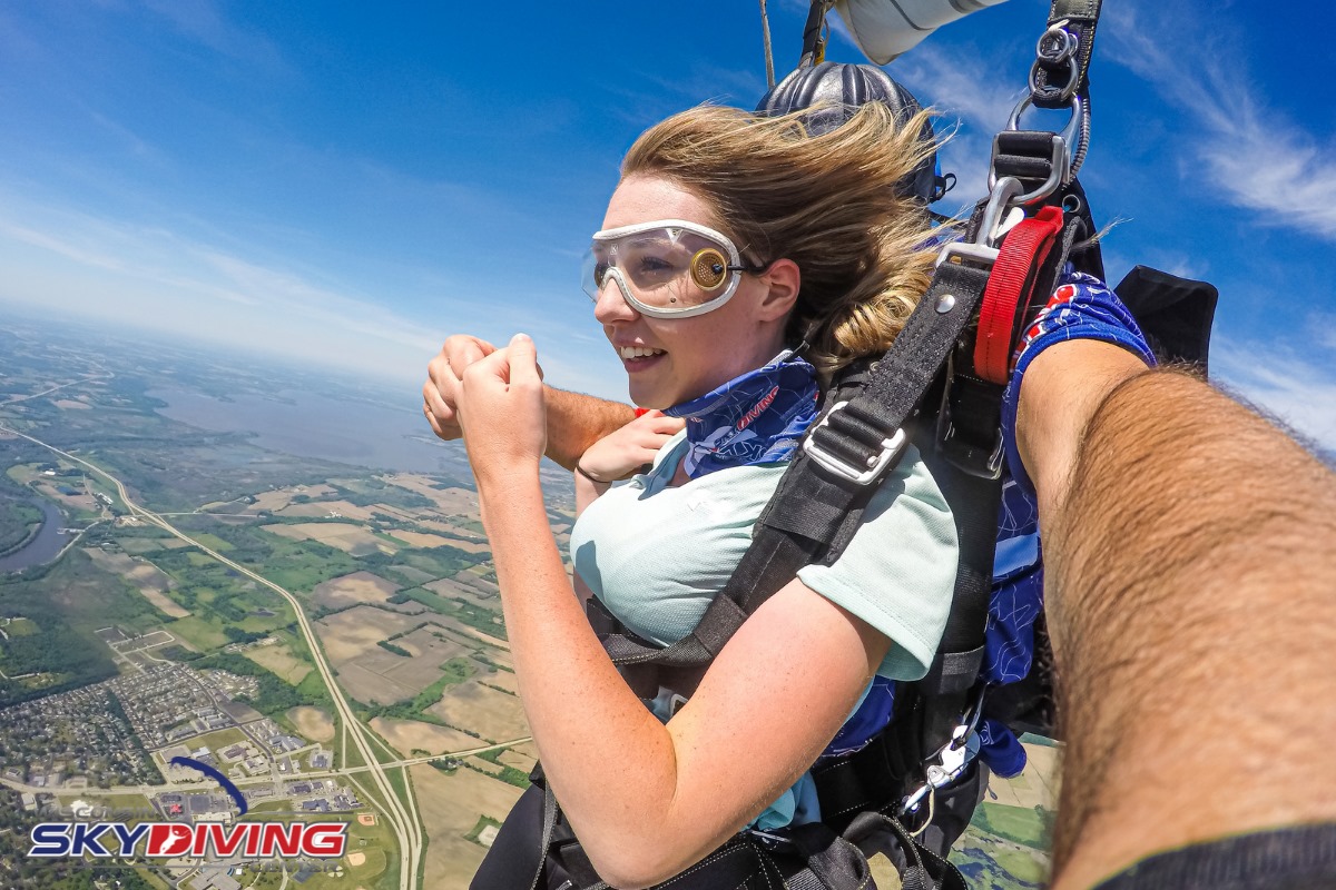 Young woman fist bumping her instructo at Wisconsin Skydiving Center near Chicago