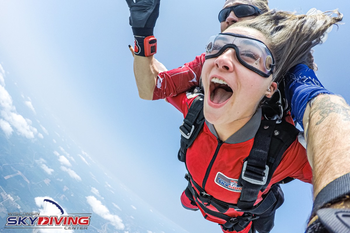 Young woman hair blowing back and no ear pain during freefall at Wisconsin Skydiving Center near Chicago