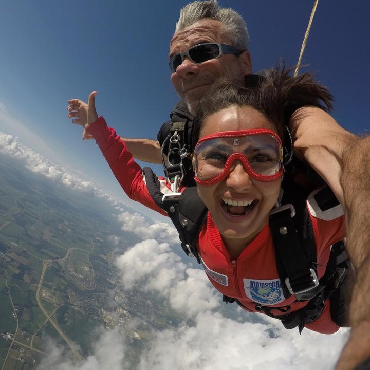 Girl smiling with joy despite medical conditions during a skydive at Wisconsin Skydiving Center near Milwaukee