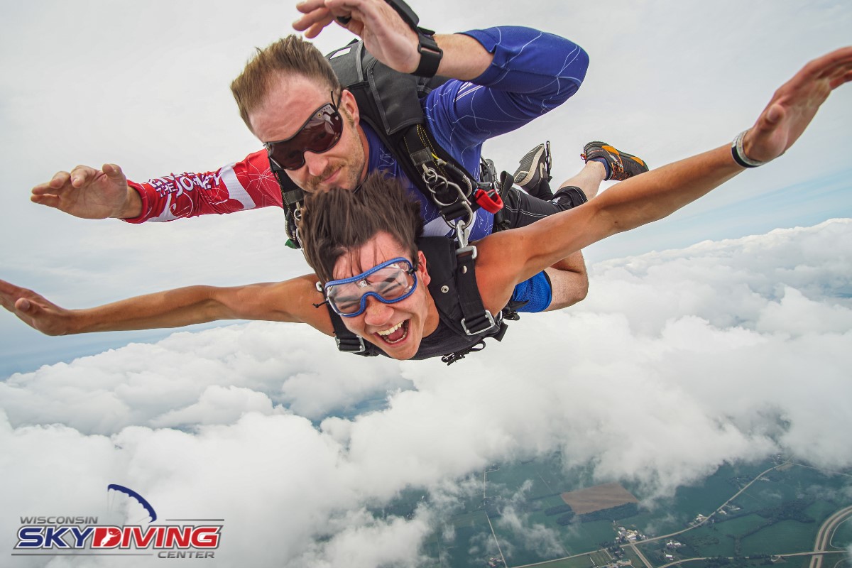 Man smiling with joy during skydiving freefall at Wisconsin Skydiving Center near Chicago