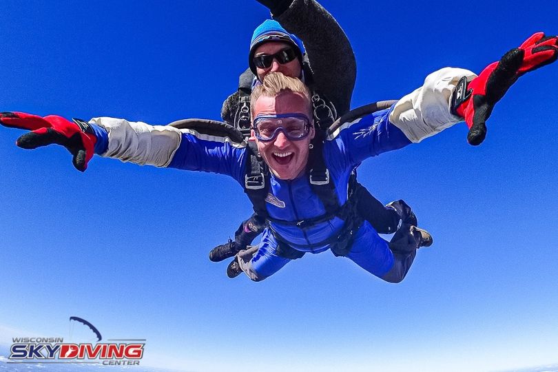 Man smiling with joy during tandem skydiving freefall at Wisconsin Skydiving Center near Chicago