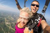 Woman enjoying tandem freefall after her first skydive at Wisconsin Skydiving Center