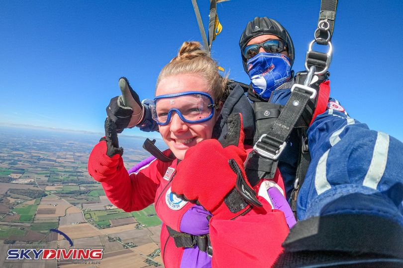 Woman with hair up in a bun after first tandem skydive at Wisconsin Skydiving Center near Chicago