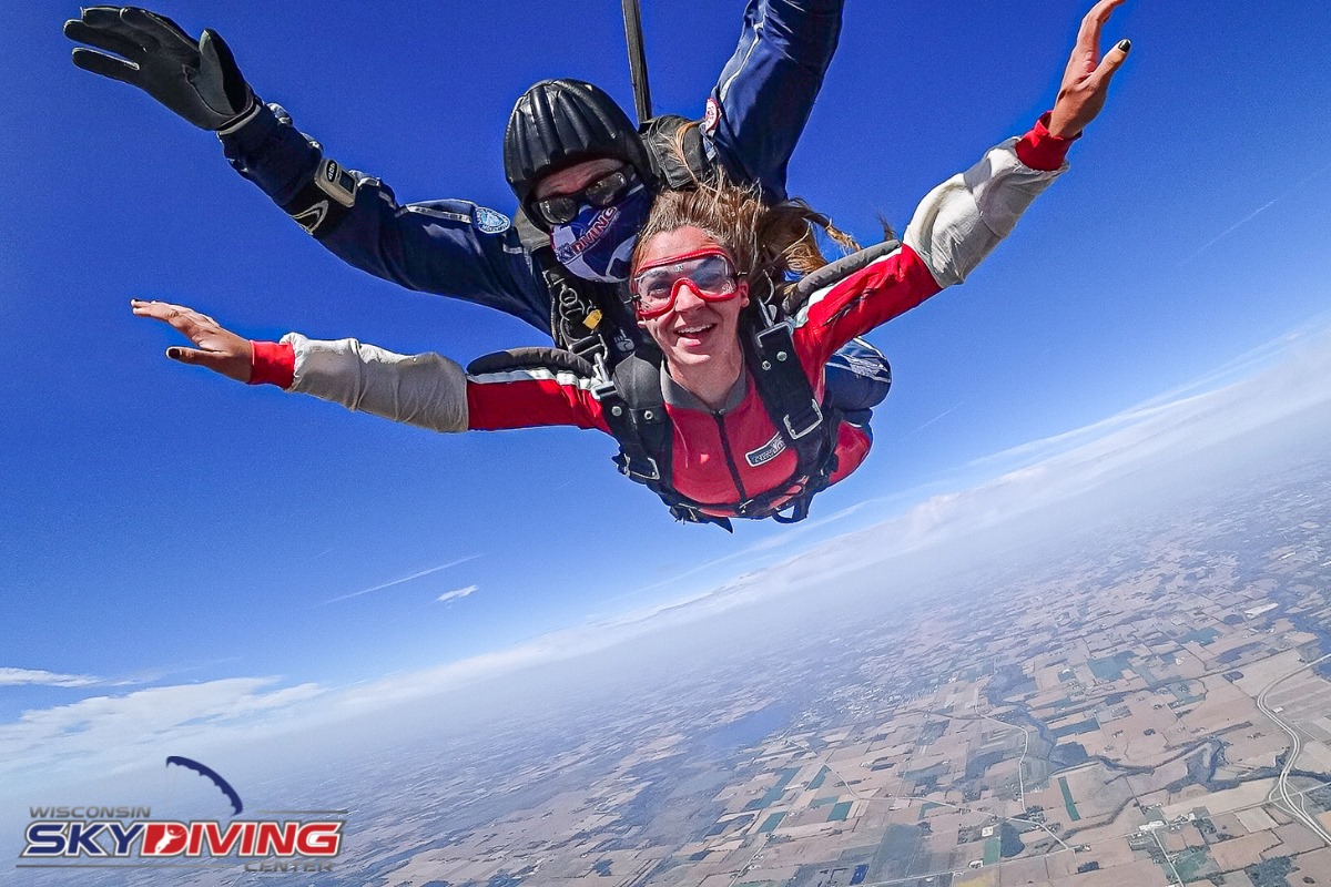 Woman smiling in freefall after jumping from a plane at Wisconsin Skydiving Center near Chicago