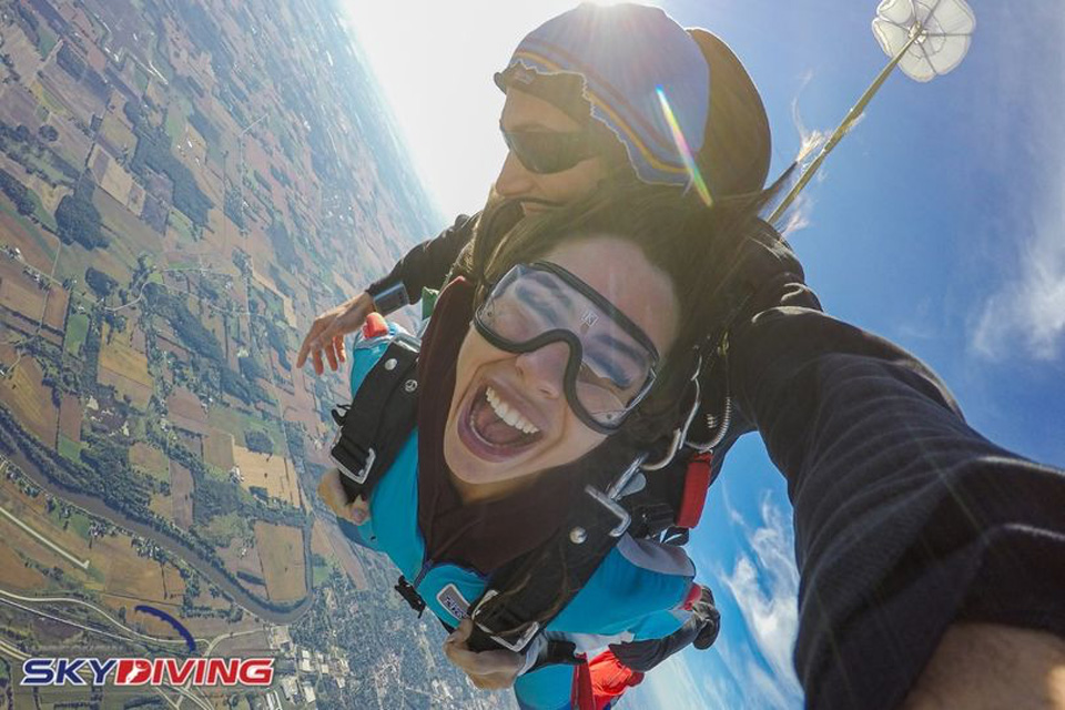 woman smiling during a freefall tandem skydive at WSC