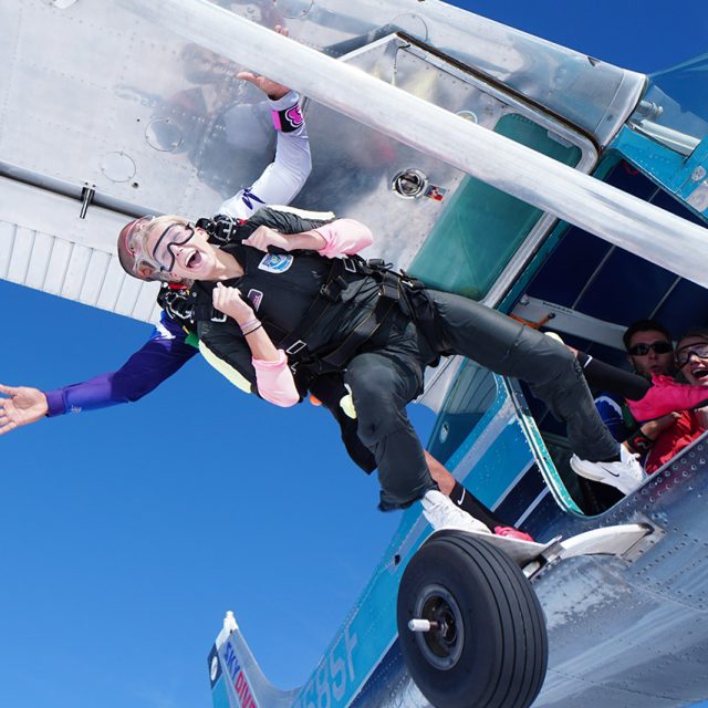 Female tandem student and her instructor while exiting the plane at Wisconsin Skydiving Center