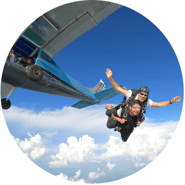 DZO Bo exiting the plane with a student at WSC.