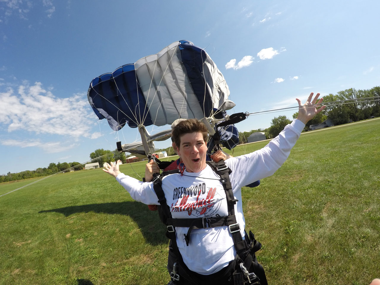 Tandem skydiver lands with their mouth open