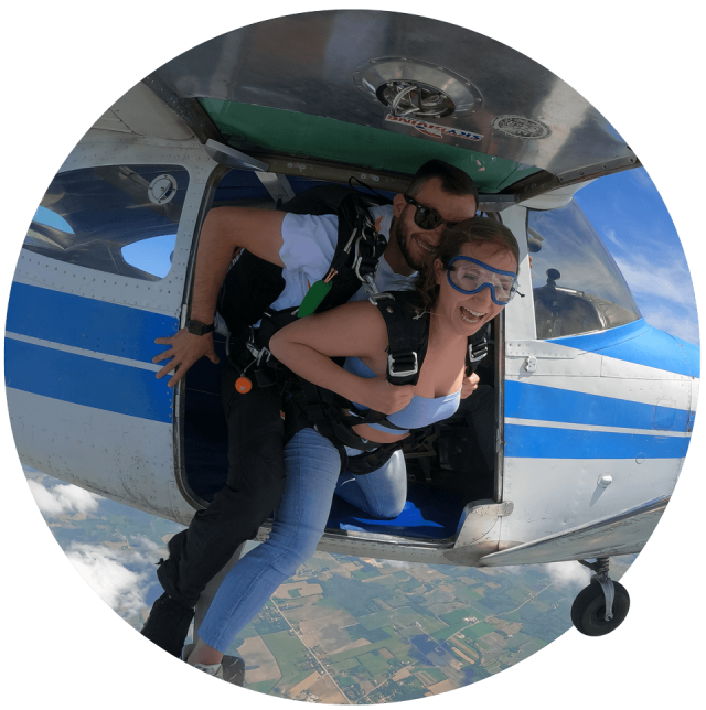 Tandem instructor exiting the plane with a student