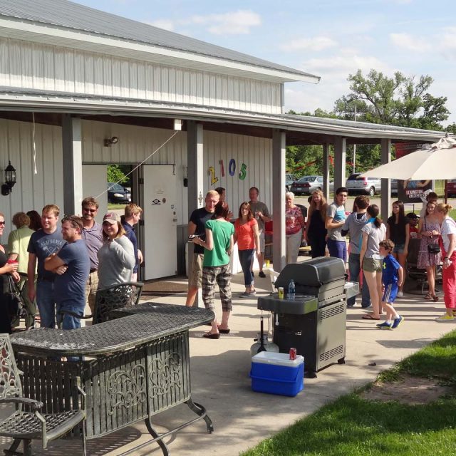 Group of skydivers and onlookers enjoying the grounds at Wisconsin Skydiving Center