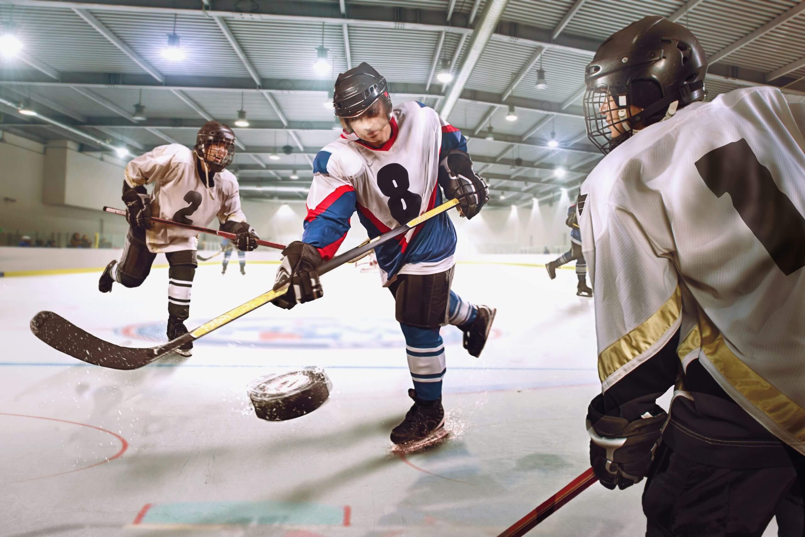 Ice hockey player shoots goal 